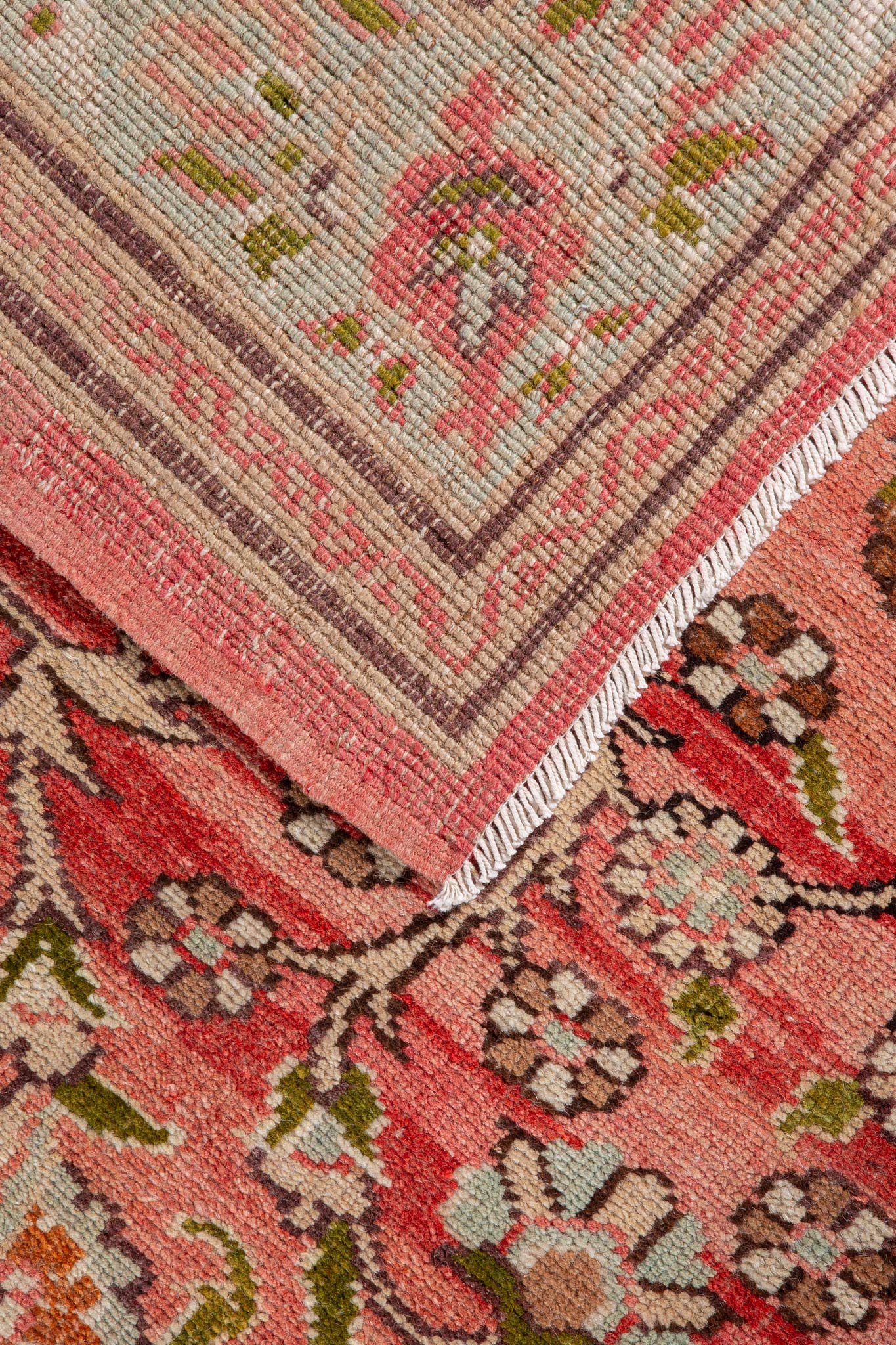 Back of small handwoven rug called Vintage Persian Tabriz, beautiful terracotta, green and beige colors with Persian floral design, shop online across Australia (Sydney, Melbourne, Canberra, Brisbane, Perth)