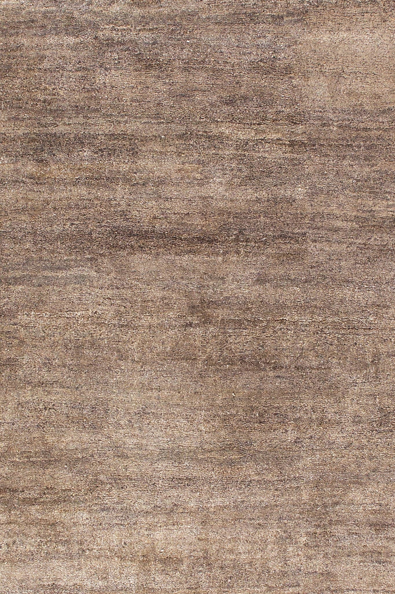 A beige and brown hand-knotted wool and silk rug with a textured design