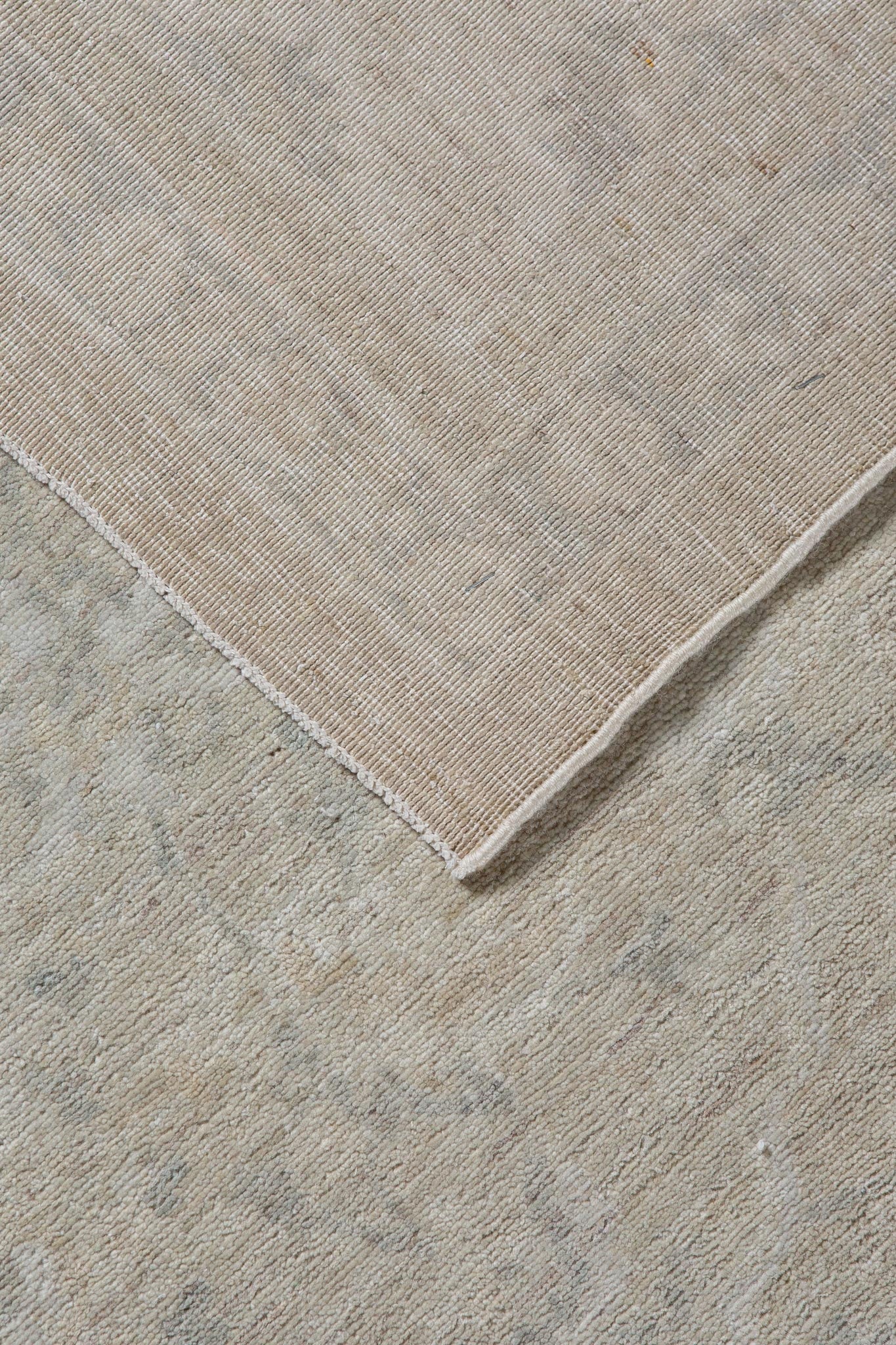 Photo of back of handwoven rug called Afghan Kandahar, Timeless Classic floral design