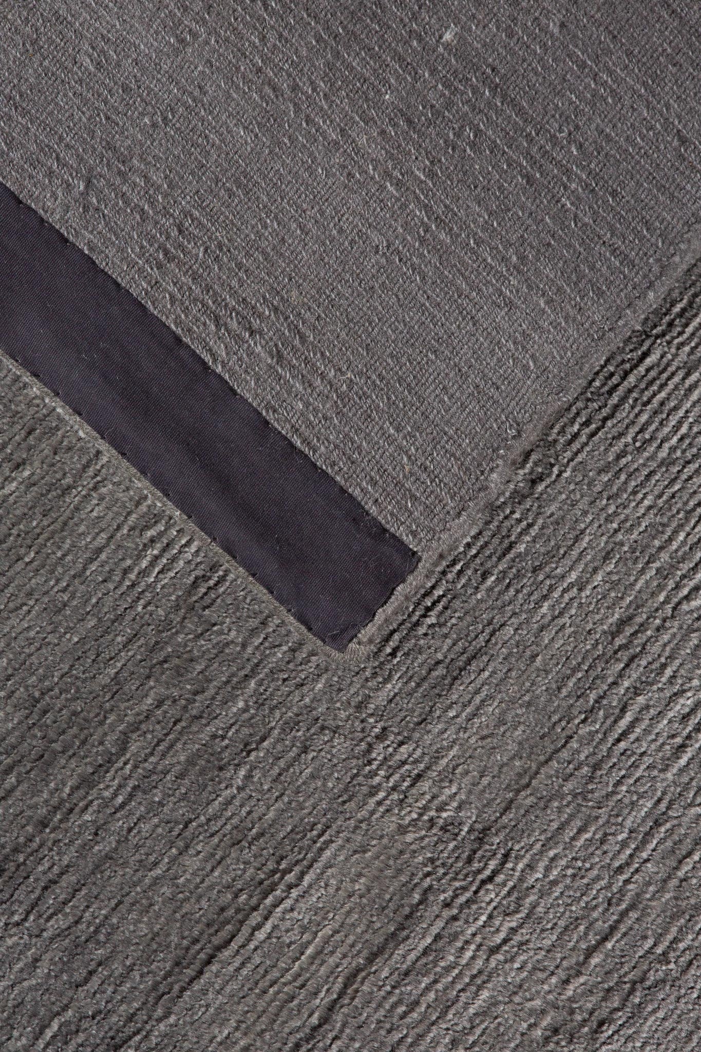 Back of handwoven grey rug, Indian Cashmere Grey Rug